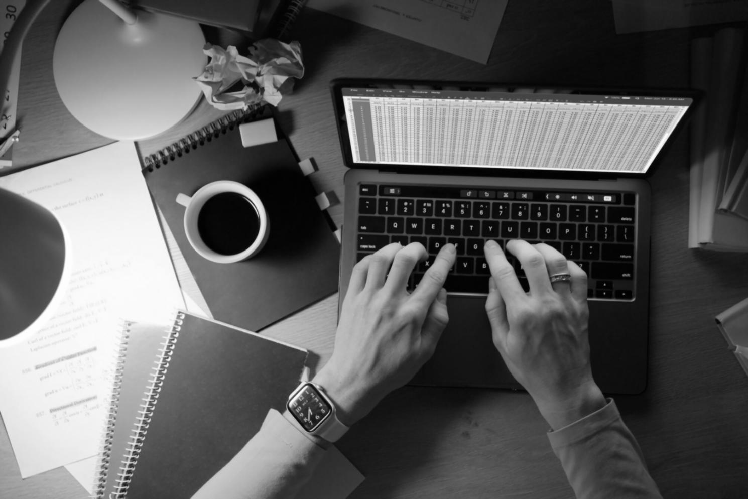 Students analyzing financial charts and market data during a hands-on learning session