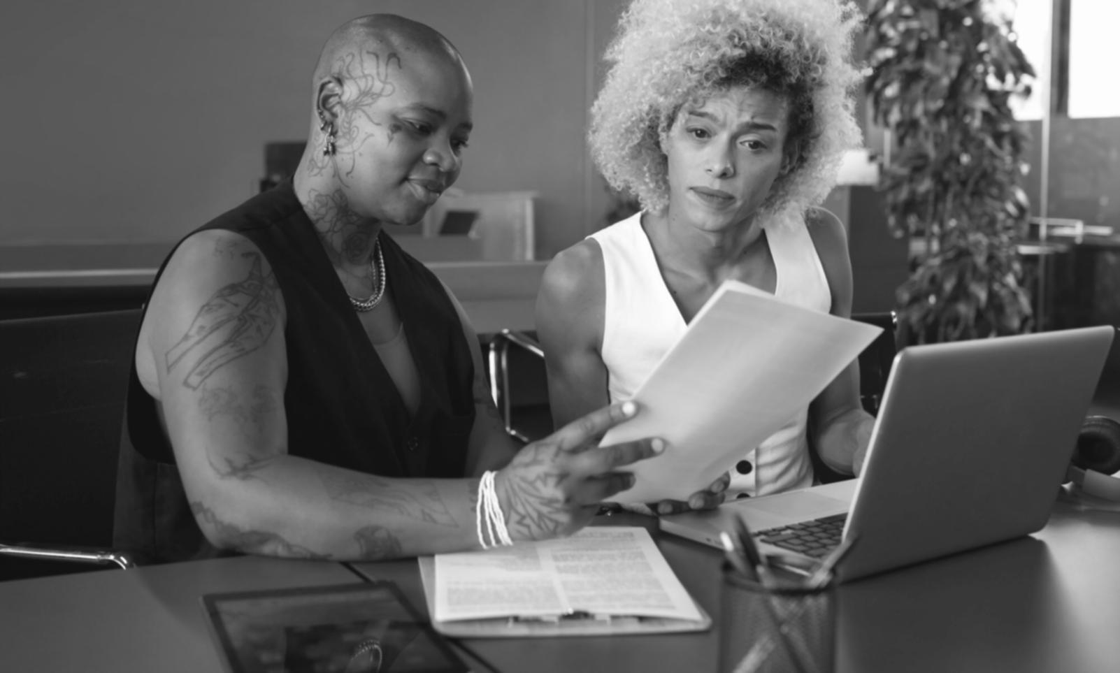 Professional investment consultation showing charts and financial planning documents